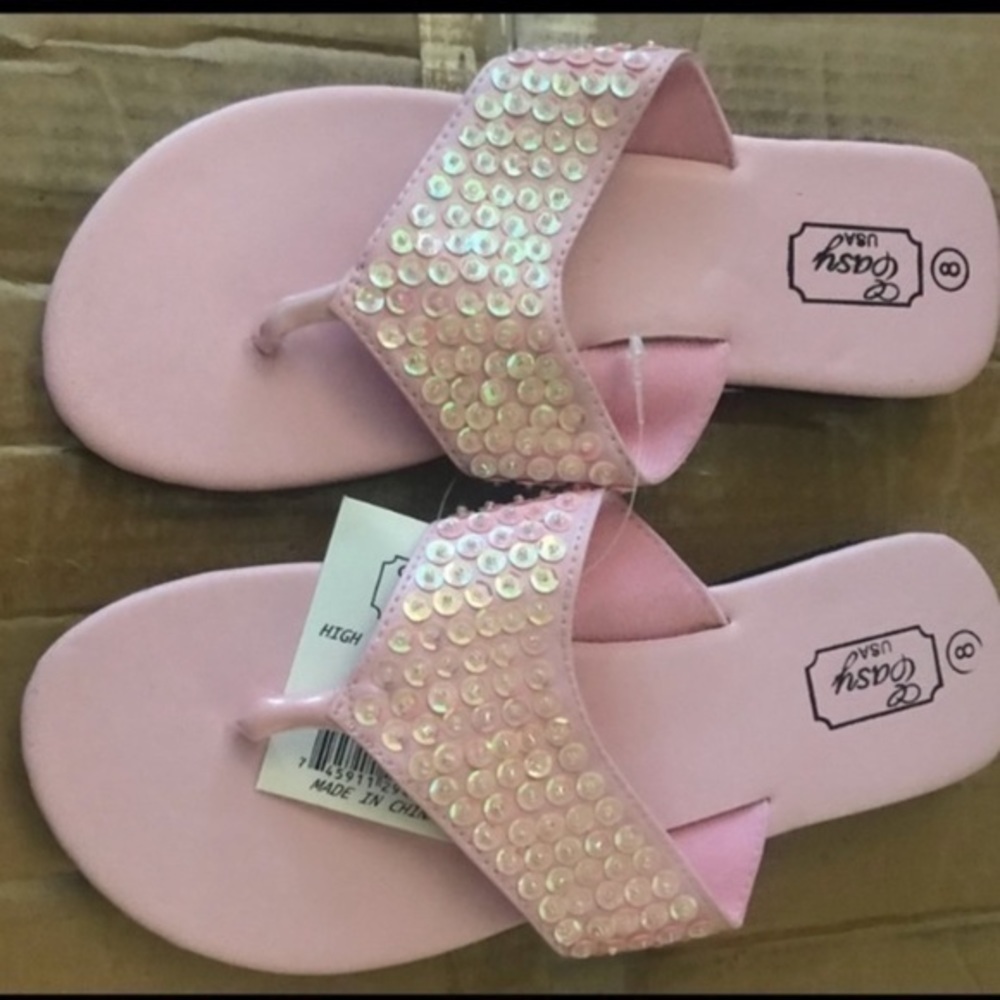 Pink rhinestone flip flops​